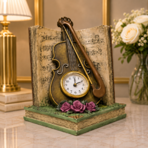 Ceas decorativ cu vioară pe carte